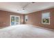 Primary bedroom with pool view and french doors at 20 Saint Croix Way, Englewood, FL 34223