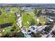 Aerial view of clubhouse and surrounding golf course at 20 Saint Croix Way, Englewood, FL 34223