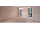 Bright dining room with neutral color palette and window shutters at 20 Saint Croix Way, Englewood, FL 34223