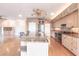 Spacious kitchen with granite island and stainless steel appliances at 20 Saint Croix Way, Englewood, FL 34223