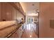 Long view of kitchen with granite countertops and light wood cabinets at 20 Saint Croix Way, Englewood, FL 34223