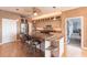 Kitchen with granite island, stainless steel appliances, and breakfast bar at 20 Saint Croix Way, Englewood, FL 34223