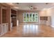 Spacious living room with built-in shelving and hardwood floors at 20 Saint Croix Way, Englewood, FL 34223