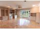 Spacious living room with built-in shelving and hardwood floors at 20 Saint Croix Way, Englewood, FL 34223