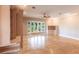 Spacious living room with built-in shelving and hardwood floors at 20 Saint Croix Way, Englewood, FL 34223