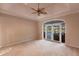 Spacious main bedroom with access to a patio and pool view at 20 Saint Croix Way, Englewood, FL 34223