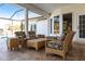 Cozy outdoor patio with comfortable seating and views of the lush landscaping at 20 Saint Croix Way, Englewood, FL 34223
