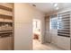 Spacious Primary closet with built-in shelving and safe at 20 Saint Croix Way, Englewood, FL 34223