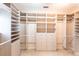 Large walk-in closet with shelving and drawers at 20 Saint Croix Way, Englewood, FL 34223