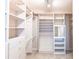 Spacious walk-in closet with ample shelving at 20 Saint Croix Way, Englewood, FL 34223