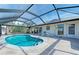 Refreshing kidney-shaped pool with screened patio cover at 201 Villa Dr # 201, Osprey, FL 34229