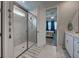 Bathroom with glass shower and view of the bedroom at 20389 Minuet Pl, Venice, FL 34293