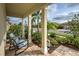 Covered porch with rocking chairs and view of neighborhood at 20389 Minuet Pl, Venice, FL 34293