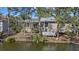 Back of house overlooking canal, screened porch and deck at 205 Tortuga Dr, Nokomis, FL 34275