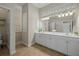 Bathroom boasts double vanity, walk-in shower, and tile flooring at 205 Tortuga Dr, Nokomis, FL 34275