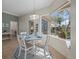Bright breakfast nook with table and chairs, offering view of pool at 205 Tortuga Dr, Nokomis, FL 34275