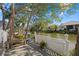 Relaxing wooden deck with canal views and landscaping at 205 Tortuga Dr, Nokomis, FL 34275