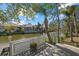 Waterfront deck with tranquil canal views and lush foliage at 205 Tortuga Dr, Nokomis, FL 34275