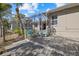 Spacious wooden deck with seating, overlooking the canal at 205 Tortuga Dr, Nokomis, FL 34275