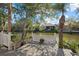Serene waterfront deck with canal views and lush landscaping at 205 Tortuga Dr, Nokomis, FL 34275