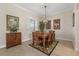 Bright dining room featuring a wooden table and chairs, perfect for Gathering meals at 205 Tortuga Dr, Nokomis, FL 34275