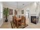 Elegant dining room with a wood table and built in fireplace at 205 Tortuga Dr, Nokomis, FL 34275