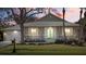 Attractive one-story house with teal double doors and a metal roof at 205 Tortuga Dr, Nokomis, FL 34275