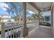 Front porch with a swing, offering a view of the neighborhood at 205 Tortuga Dr, Nokomis, FL 34275