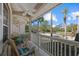 Relaxing front porch with rocking chairs, overlooking a quiet street at 205 Tortuga Dr, Nokomis, FL 34275