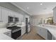 Large kitchen offering ample counter space, stainless steel appliances, and a breakfast bar at 205 Tortuga Dr, Nokomis, FL 34275