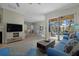 Living room showcasing a cozy seating arrangement with views of the pool area at 205 Tortuga Dr, Nokomis, FL 34275
