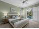 Spacious bedroom with pool view, light walls, and calming decor at 205 Tortuga Dr, Nokomis, FL 34275