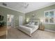 Spacious main bedroom with king-size bed and en-suite bathroom at 205 Tortuga Dr, Nokomis, FL 34275