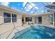Refreshing screened pool and patio with canal views at 205 Tortuga Dr, Nokomis, FL 34275