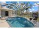 Enclosed pool area with spa and picturesque canal views at 205 Tortuga Dr, Nokomis, FL 34275