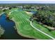 Aerial view of golf course and lake at 2111 Tocobaga Ln, Nokomis, FL 34275