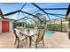 Relaxing pool area with covered patio and seating at 221 Firenze W Ave, Venice, FL 34285