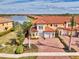Aerial view showing townhome with lake views and community at 23210 Banbury Way # 101, Venice, FL 34293
