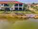 Back patio of villa overlooking a lake at 23210 Banbury Way # 101, Venice, FL 34293
