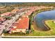 Aerial view of community with lake and villas at 23210 Banbury Way # 101, Venice, FL 34293