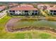 Back patio of villa overlooking a lake at 23210 Banbury Way # 101, Venice, FL 34293