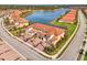 Bird's eye view of a stunning property nestled beside a tranquil lake at 23210 Banbury Way # 101, Venice, FL 34293