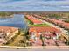 Aerial view showcasing a beautiful home in a desirable community by the lake at 23210 Banbury Way # 101, Venice, FL 34293