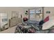 Comfortable bedroom with queen-size bed and large window at 23210 Banbury Way # 101, Venice, FL 34293