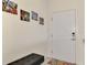 Modern entryway with a small bench and artwork at 23210 Banbury Way # 101, Venice, FL 34293