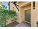 Inviting front entrance with a dark green door and brick walkway at 23210 Banbury Way # 101, Venice, FL 34293