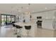 Modern kitchen with stainless steel appliances and island at 23210 Banbury Way # 101, Venice, FL 34293