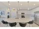 Modern kitchen with white cabinets, stainless steel appliances, and an island at 23210 Banbury Way # 101, Venice, FL 34293