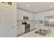 Modern kitchen with white cabinets and stainless steel appliances at 23210 Banbury Way # 101, Venice, FL 34293