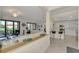 Open floor plan with modern kitchen and spacious living area at 23210 Banbury Way # 101, Venice, FL 34293